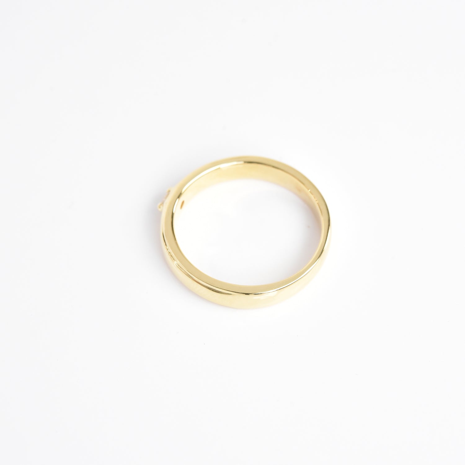 Gold Band with a Solitaire Ring
