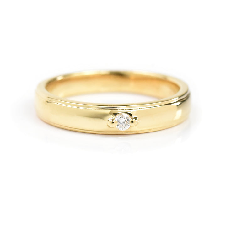 Gold Band with a Solitaire Ring